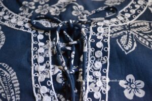 Blue top with delicate white embroidery embellishments