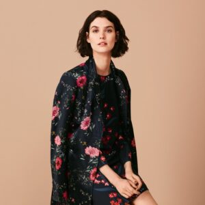 Model wearing a flowery coat